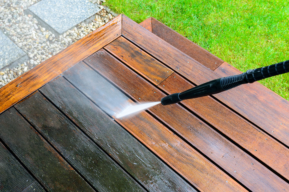 Wooden deck restored to original condition through pressure washing