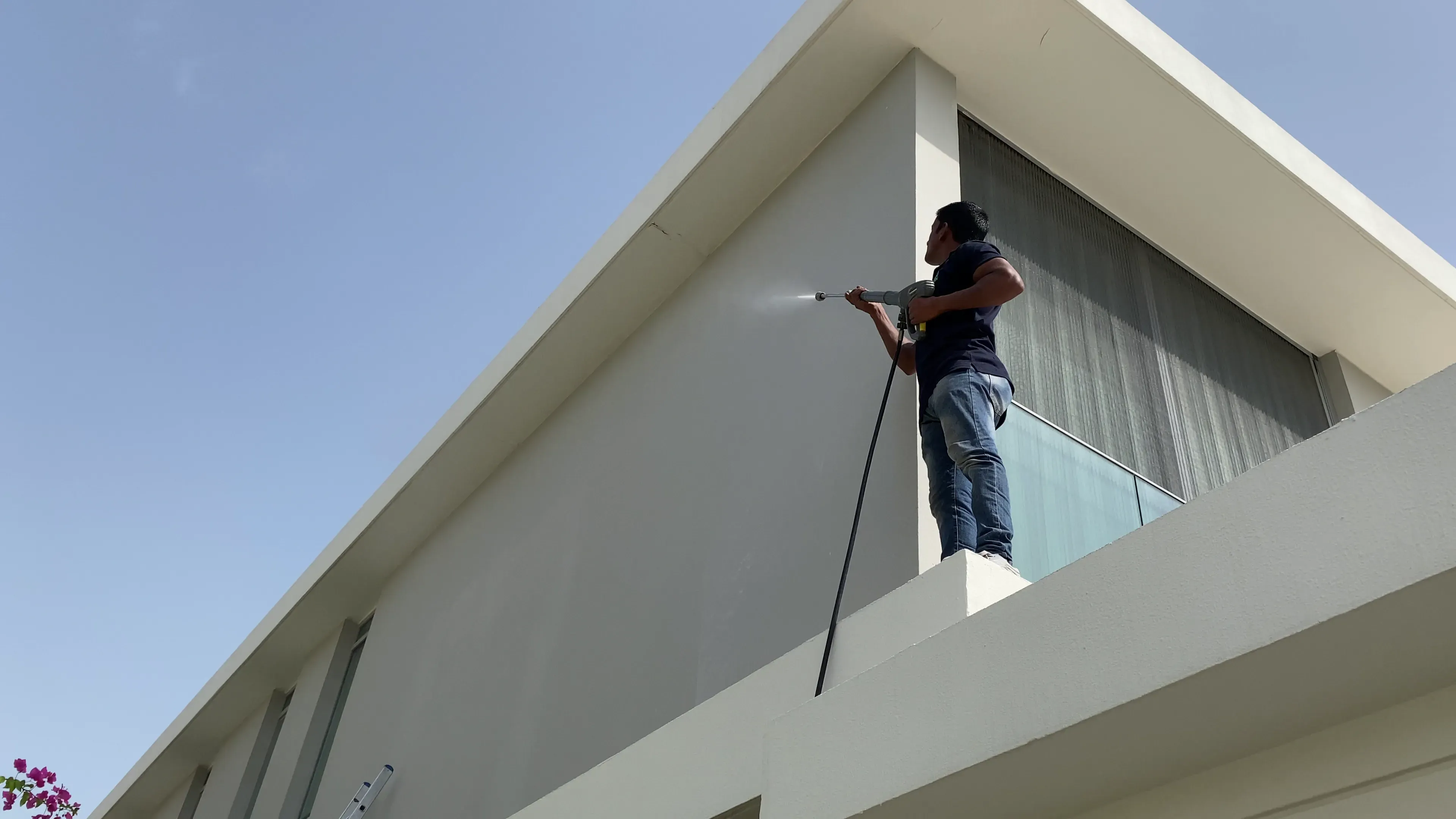 Euro Property Maintenance team at work steam cleaning a building